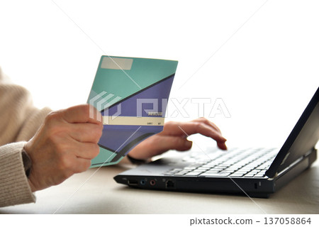 Seniors checking their savings passbook Seniors checking their savings passbook 137058864