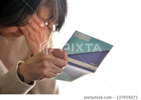 Seniors checking their savings passbook 137058871