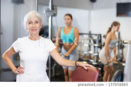 Portrait of an elderly positive woman in modern gym Portrait of an elderly positive woman in modern gym 137058883