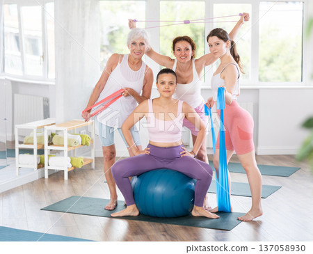 Group of women posing with pilates equipment Group of women posing with pilates equipment 137058930
