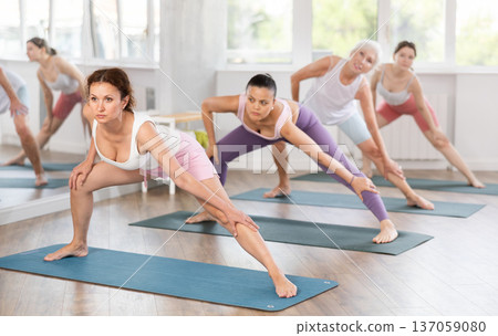 Adult woman doing pilates in group 137059080