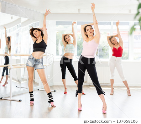 Group of women dancing high heels in studio 137059106