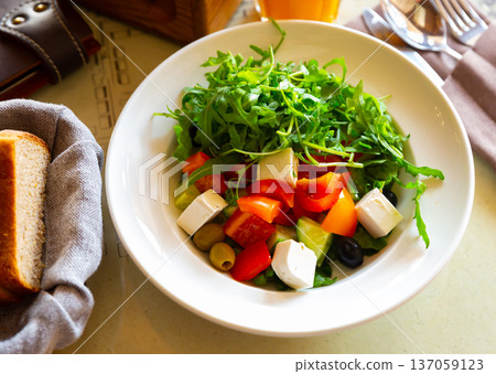 Greek salad with fresh vegetables and feta cheese Greek salad with fresh vegetables and feta cheese 137059123