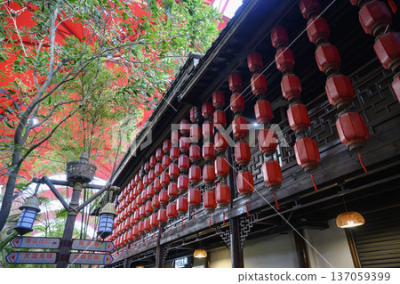Building decorated with traditional red Chinese lanterns in Sanya Park on Hainan Island in China Building decorated with traditional red Chinese lanterns in Sanya Park on Hainan Island in China 137059399