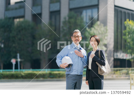 Men in work clothes and women in suits 137059492