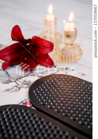 Practice yoga. Board sadhu. Sharp nails on mat in front of burning fire candles arranged tools for spiritual growth mental health. Practice yoga. Board sadhu. Sharp nails on mat in front of burning fire candles arranged tools for spiritual growth mental health. 137059667