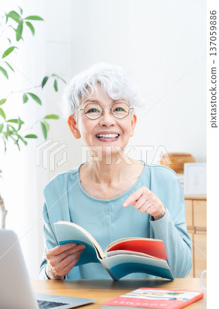 Senior woman reading a book 137059886