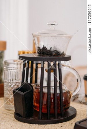 Glass teapot. Healthy herbal drink. Transparent brew water tasty liquid clear ware for tea ceremony calming fresh beverage. 137059945