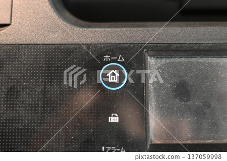 Glowing blue home button on electronic device panel Glowing blue home button on electronic device panel 137059998