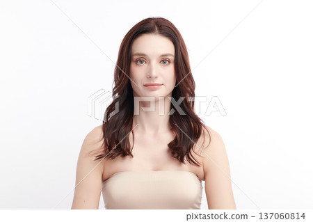 A beautiful young woman with clean, fresh skin against a white background. Skincare, facial treatment, cosmetology, beauty, and spa. An elegant portrait of an woman. A beautiful young woman with clean, fresh skin against a white background. Skincare, facial treatment, cosmetology, beauty, and spa. An elegant portrait of an woman. 137060814