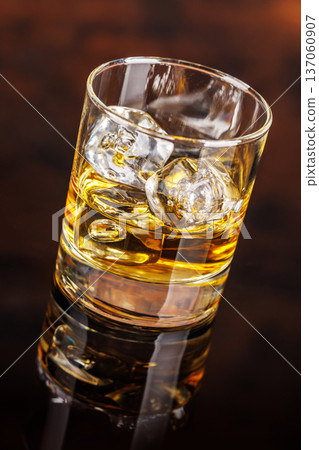 Glass of whiskey with ice 137060907
