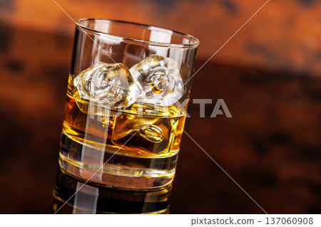 Glass of whiskey with ice 137060908