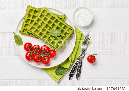 Green vegan spinach waffles top view Green vegan spinach waffles top view 137061381
