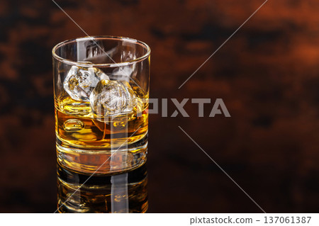 Glass of whiskey with ice 137061387