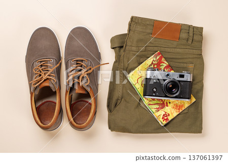 Safari clothing and gear on beige background 137061397