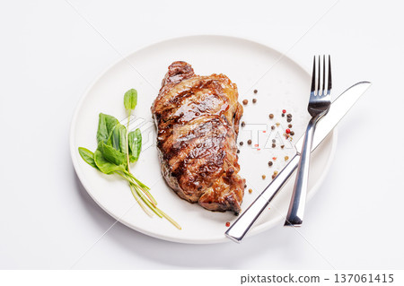A perfectly cooked striploin steak with a juicy, tender texture A perfectly cooked striploin steak with a juicy, tender texture 137061415