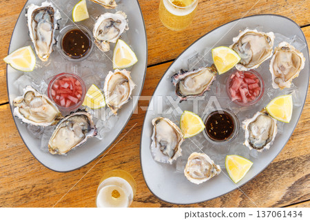 Fresh oysters on ice with champagne 137061434