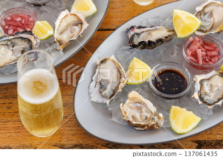 Fresh oysters on ice with champagne 137061435