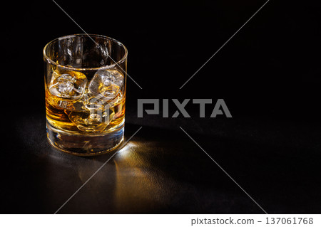 Glass of whiskey with ice Glass of whiskey with ice 137061768