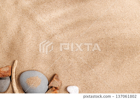 A tropical summer background featuring soft beach sand with delicate palm leaf shadows A tropical summer background featuring soft beach sand with delicate palm leaf shadows 137061802