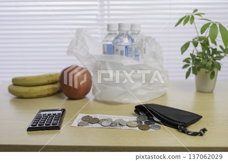 Japanese coins and plastic bags, representing saving money, household management, and shopping Japanese coins and plastic bags, representing saving money, household management, and shopping 137062029