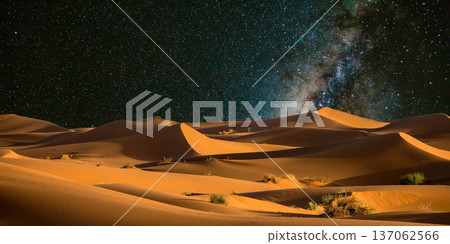 night landscape with desert dunes, starry sky and milky way in desert, abstract background. night landscape with desert dunes, starry sky and milky way in desert, abstract background. 137062566