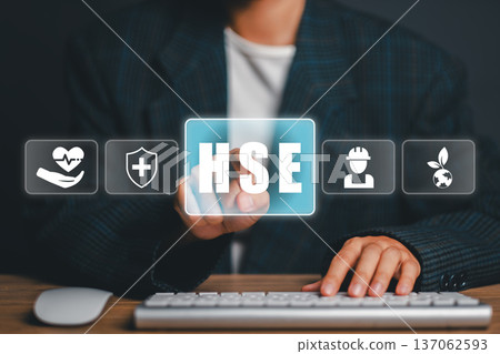 Professional engaging with digital HSE interface, emphasizing health, safety, and environmental management in the workplace. Professional engaging with digital HSE interface, emphasizing health, safety, and environmental management in the workplace. 137062593