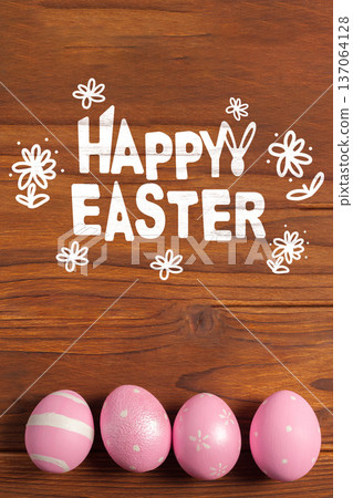Colorful Easter eggs and greeting on wood surface for Easter celebration 137064128
