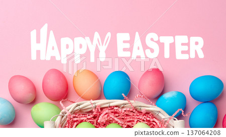 Colorful Easter eggs in a basket with a cheerful Happy Easter message on a pink background Colorful Easter eggs in a basket with a cheerful Happy Easter message on a pink background 137064208