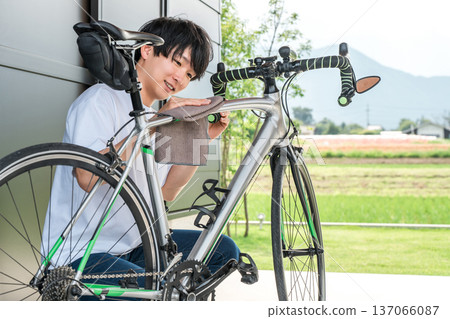 Bicycle, young Asian man doing maintenance on road bike 137066087