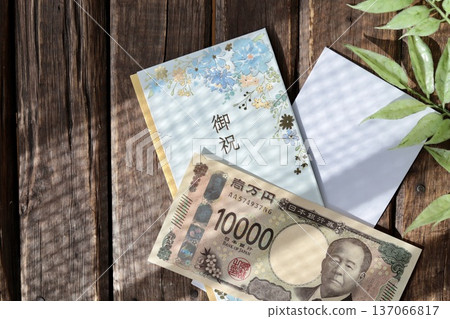 A light blue floral gift envelope and a new 10,000 yen bill 137066817
