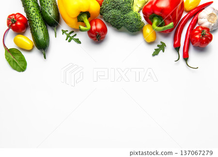 Fresh organic vegetables creating healthy eating border on white 137067279