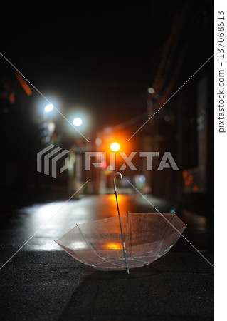 A night after the rain, a transparent umbrella, and the light of a traffic light A night after the rain, a transparent umbrella, and the light of a traffic light 137068513