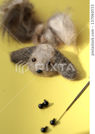 A needle-felted miniature dachshund mascot made from dog hair 137068553