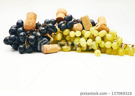 Black ripe grapes and wine stopper.Brandy, cognac Black ripe grapes and wine stopper.Brandy, cognac 137069328