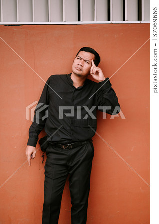 Pensive Man Contemplating Difficult Decision Against Plain Wall Pensive Man Contemplating Difficult Decision Against Plain Wall 137069666