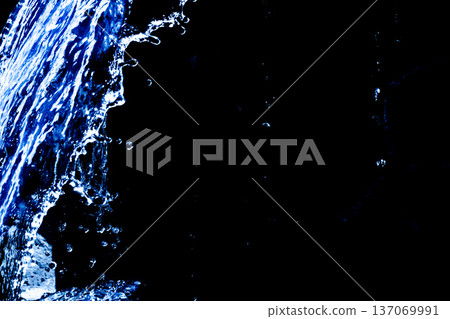 Falling water close-up and black background Falling water close-up and black background 137069991