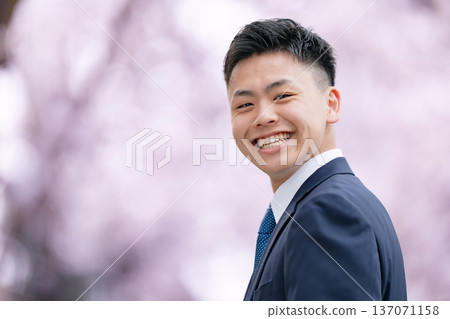 Freshers, young men in suits, cherry blossoms Freshers, young men in suits, cherry blossoms 137071158