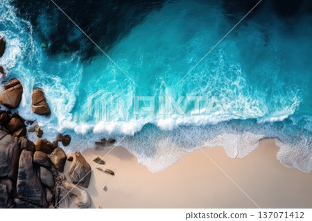 Mesmerizing Top Down Perspective of Foamy Turquoise Waves Against Sandy Shoreline Mesmerizing Top Down Perspective of Foamy Turquoise Waves Against Sandy Shoreline 137071412