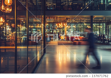 Modern Hybrid Work Environment Featuring Employees Collaborating in Stylish Office Space 137071762