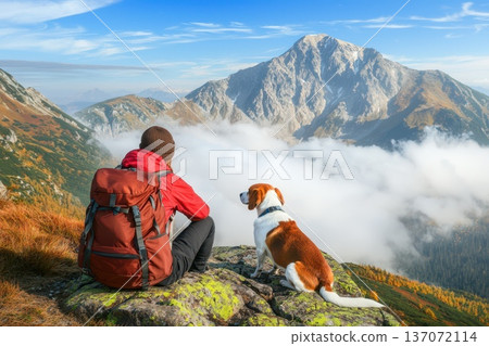 Traveler with Backpack Taking Rest on Mountaintop with Dog and Scenic View Traveler with Backpack Taking Rest on Mountaintop with Dog and Scenic View 137072114