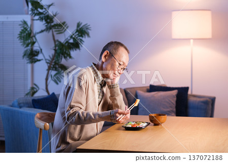 Senior man eating lunch alone Senior man eating lunch alone 137072188