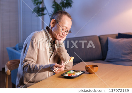 Senior man eating lunch alone Senior man eating lunch alone 137072189