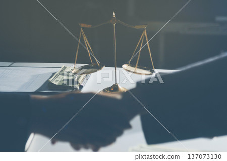 Businesswoman and Male lawyer or judge consult and conference having team meeting with client at law firm in office, Law and Legal services concept 137073130