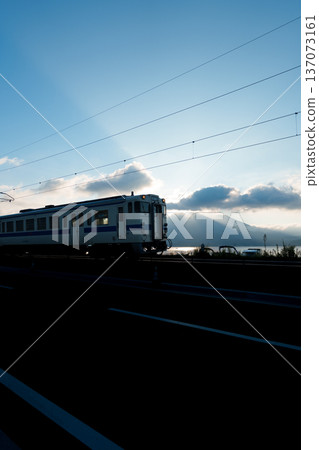 A train running in the morning sun 137073161