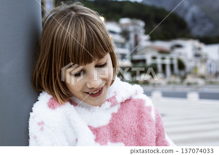 little cute blond girl curious smiling playing outside on sea, lifestyle people concept little cute blond girl curious smiling playing outside on sea, lifestyle people concept 137074033