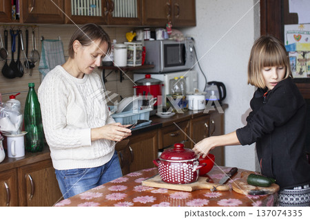 big family having dinner with mother working on laptop, lifestyle people concept big family having dinner with mother working on laptop, lifestyle people concept 137074335