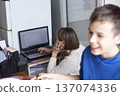 mother with daughter at home working on laptop, lifestyle people concept 137074336