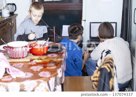 big family having dinner with mother working on laptop, lifestyle people concept big family having dinner with mother working on laptop, lifestyle people concept 137074337