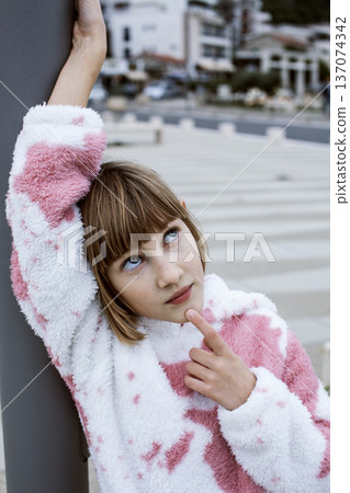 little cute blond girl curious smiling playing outside on sea, lifestyle people concept 137074342